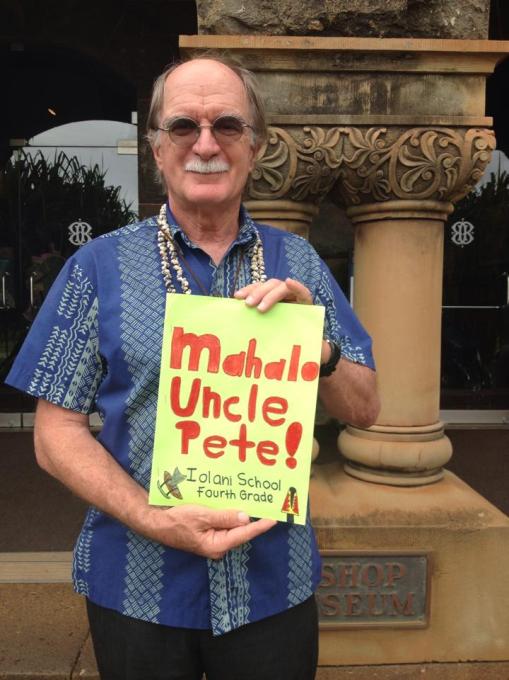 Uncle Pete with the book of thank you notes from Iolani School fourth graders